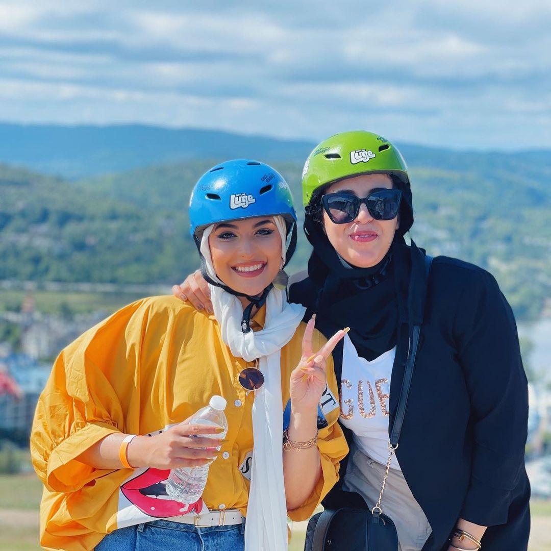 Two friends pose for a photo at Skyline Luge Mont Tremblant.